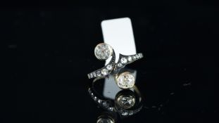 Old cut and rose cut diamond crossover ring, mounted in yellow and white metal with French owl and