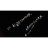 Topaz drop earrings, three chain drops set from each stud, each terminated by a briolette cut blue