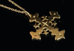 A yellow metal cross pendant, tested as 9ct or higher, gross weight approximately 7.70 grams