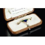 A Murrle Bennett & Co blue to green enamel brooch, set in yellow metal stamped 9ct, with makers