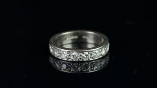 Diamond half eternity ring, seven round brilliant cut diamonds weighing an estimated 0.75ct, set