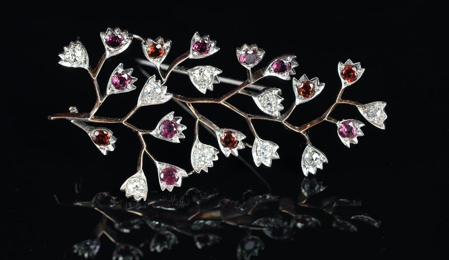 A garnet and diamond floral brooch, set with round cut garnets and old cut diamonds, estimated total - Image 2 of 2