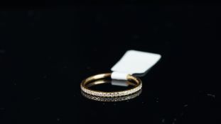 A diamond full eternity ring, round brilliant cut diamonds, claw set in 18ct rose gold, finger