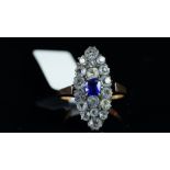 Vintage blue and white paste stone cluster ring, mounted in unmarked rose metal tested as 9ct,