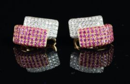 Pink sapphire and diamond dress earrings, a panel of bombe set diamonds behind a panel of bombe