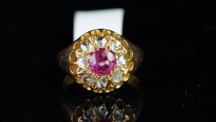 Burma ruby and diamond cluster ring, central round cut Burmese ruby, surrounded by rose cut