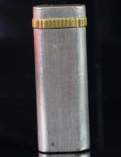 Cartier white and yellow metal lighter, serial number 1 98096, weight approximately 78.9 grams. A/