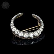 A Victorian diamond crescent brooch, graduated old cut diamonds, weighing an estimated total of 2.