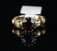 Single stone garnet claddagh ring, mounted in hallmarked 9ct yellow gold, finger size K 1/2,