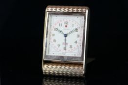 VINTAGE CARTIER DATE DAY 9KT GOLD TRAVEL CLOCK CIRCA 1964, rectangular off white dial with Arabic