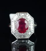 Diamond and glass filled ruby ring, central oval cut glass filled ruby measuring an estimated 9.33 x