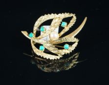 Pearl and turquoise stone floral brooch, mounted in yellow metal stamped '333', with pin and