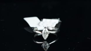 NEW OLD STOCK, UNWORN RETIRED STOCK - A single stone diamond ring, 0.71ct marquise cut diamond, claw