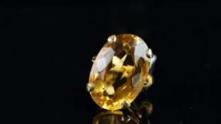Single stone citrine ring, mounted in unmarked yellow metal tested as 9ct gold, large oval mixed cut