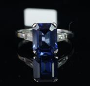 Synthetic sapphire and white stone ring, mounted in white metal stamped 18ct, central ocTagonal