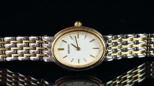 NEW OLD STOCK - LADIES' BICOLOUR SEIKO QUARTZ WRISTWATCH, REF LW754, 18mm case, oval white dial,