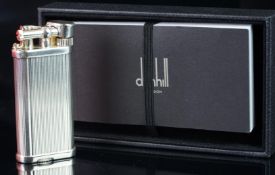 Dunhill white metal lighter, serial number 61150, in fitted Dunhill box, with instruction booklet