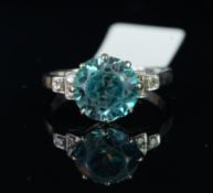 Blue zircon and diamond ring, mounted in white metal stamped '18ct Plat', central round blue zircon,