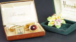 Group of costume jewellery pieces including a fine bone china flower brooch in Harrods box, and
