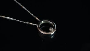 Single stone diamond pendant on chain, mounted in unmarked white metal tested as 9ct white gold,