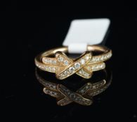 An 18ct rose gold Chaumet Jenx de Liens ring, designed as a central diamond set 'X' on a diamond set