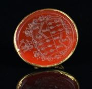 A carnelian seal fob, with a gold handle (damaged), oval carved carnelian seal of a coat of arms,