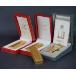 Mixed lot of four lighters including 1x Cartier lighter with serial 1B05445, 1x Must de Cartier