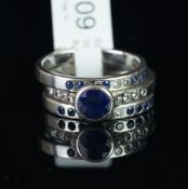 An engagement ring and wedding band set, comprising a sapphire and diamond engagement ring,