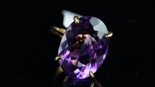 A single stone amethyst ring, weighing an estimated 19.24ct, set in 9ct yellow gold, hallmarked