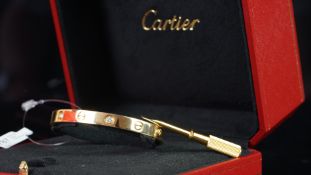 Cartier diamond set 'Love' bangle, 18c yellow gold set with alternate brilliant cut diamonds and