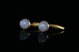 Pair of cabochon chalcedony cufflinks, mounted in unmarked white and yellow metal, gross weight