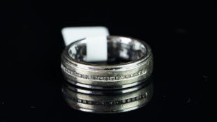 A diamond set band ring, channel set diamonds, mounted in 9ct white gold, gross weight approximately