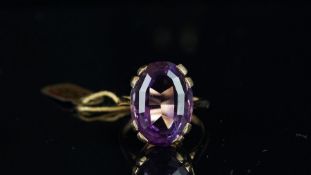 Single stone amethyst ring, mounted in hallmarked 9ct yellow gold, oval mixed cut amethyst, stated