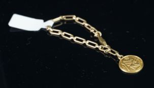 A 9ct yellow gold St Christopher, on a very small child's bracelet, reverse of St Christopher marked