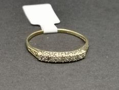 Diamond half eternity ring, illusion set with three small diamonds, mounted in 9ct yellow gold, ring