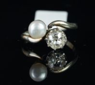 Two stone old cut diamond and pearl crossover ring, mounted in unmarked white metal, single old