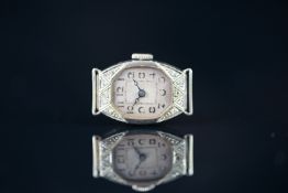 LADIES' DIAMOND SET COCKTAIL MANUAL WIND WRISTWATCH, 15mm lozenge shaped case, unmarked white metal,