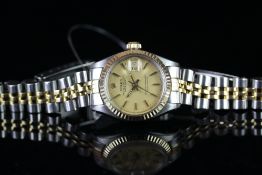 LADIES' BI-COLOUR ROLEX OYSTER PERPETUAL DATEJUST REFERENCE 6917, circular champagne dial with baton