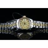LADIES' BI-COLOUR ROLEX OYSTER PERPETUAL DATEJUST REFERENCE 6917, circular champagne dial with baton