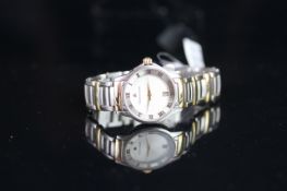 LADIES' MAURICE LACROIX DATE WRISTWATCH, circular white dial with gold dauphine hands, date aperture