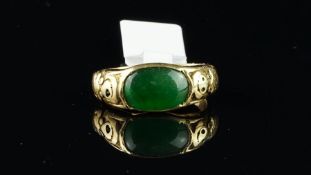 Rare Chinese jade ring, oval green jade measuring 10.8 x 7.22mm, with ornate carved dragons to