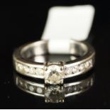 Diamond ring, central round brilliant cut diamond weighing an estimated 0.40ct, with diamond set