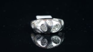 Farone designer diamond ring, mounted in white metal stamped 'Pt 950', set with concave sections