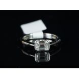 Single stone diamond ring, emerald cut diamond weighing an estimated 0.71ct, estimated colour F,