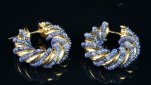 Pair of sapphire bead twist design hoop earrings, mounted in yellow metal stamped 750 and tested