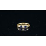 Period Sapphire and diamond five stone ring, three round cut diamonds with two sapphires,