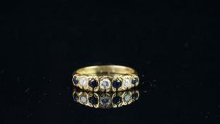 Blue and white stone seven stone ring, mounted in hallmarked 18ct yellow gold, finger size J 1/2,