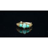 Turquoise three stone carved ring, central oval cut turquoise a round cut to each side, carved
