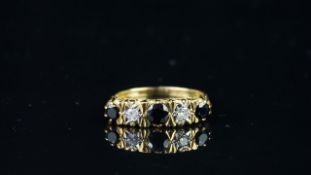 Sapphire and diamond carved half hoop ring, mounted in hallmarked 18ct yellow gold, three round