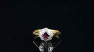 Ruby and diamond round cluster ring, mounted in hallmarked 18ct yellow gold, finger size K,